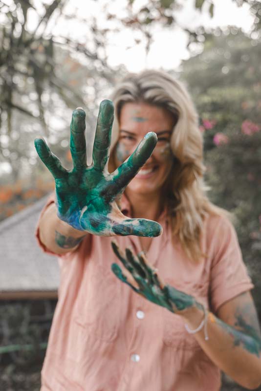 Artist With Green Paint On Hands
